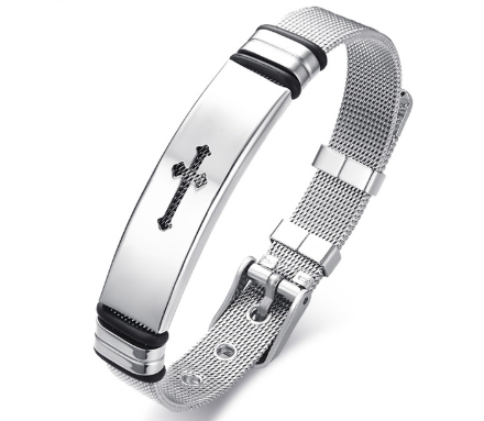 Silver bracelet with a cross charm on a white background