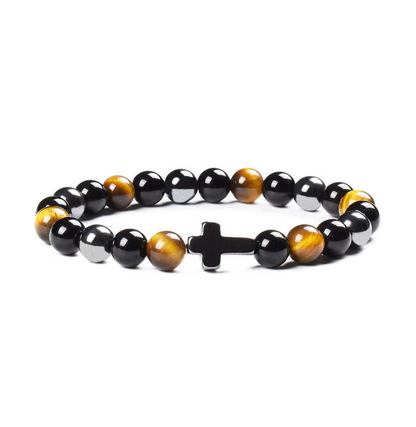 Beaded bracelet with black, yellow, and silver beads on a white background
