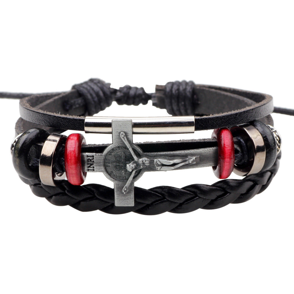 Black braided leather bracelet with metal bar and red accents on a white background