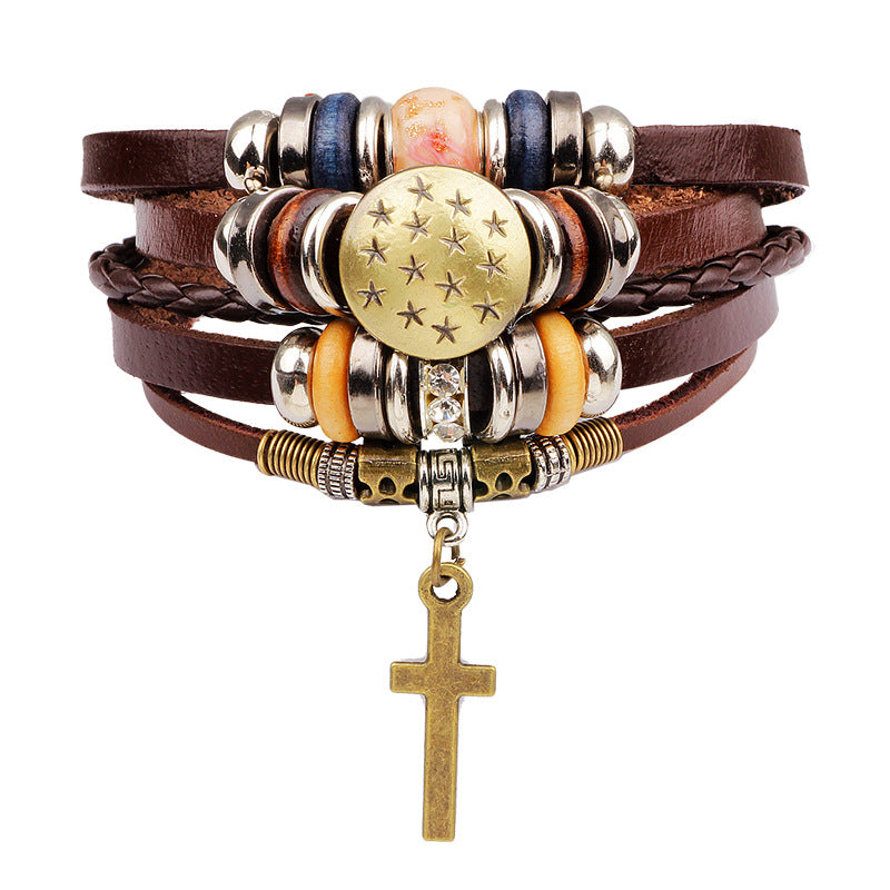 Multistrand bracelet with beads and a cross charm on a white background