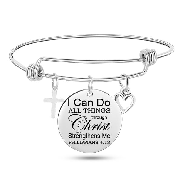 Silver bracelet with circular charm featuringPhilippians 4:13 on a white background