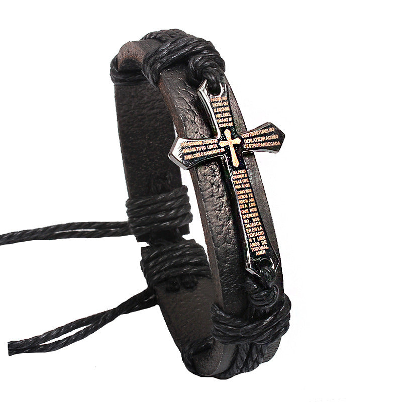 Black leather bracelet with a cross pendant on a white background