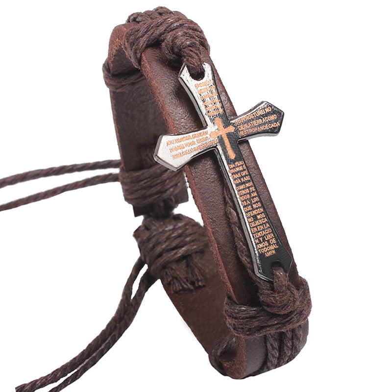 Brown braided leather bracelet with a cross pendant on a white background