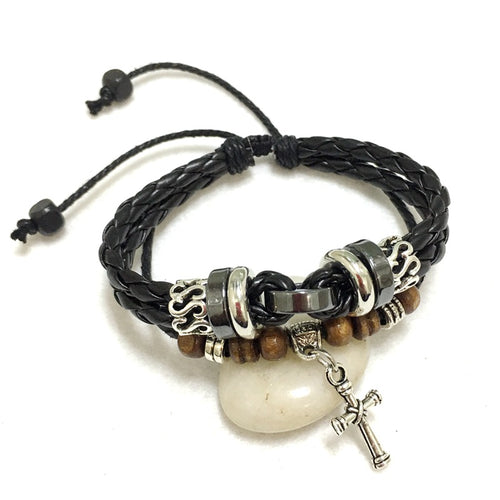 Black braided leather bracelet with silver and wooden beads on a white background