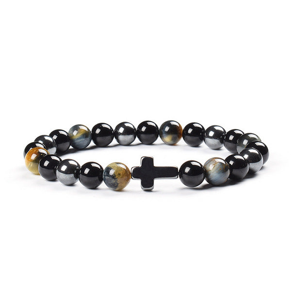 Black beaded bracelet with a cross charm on a white background